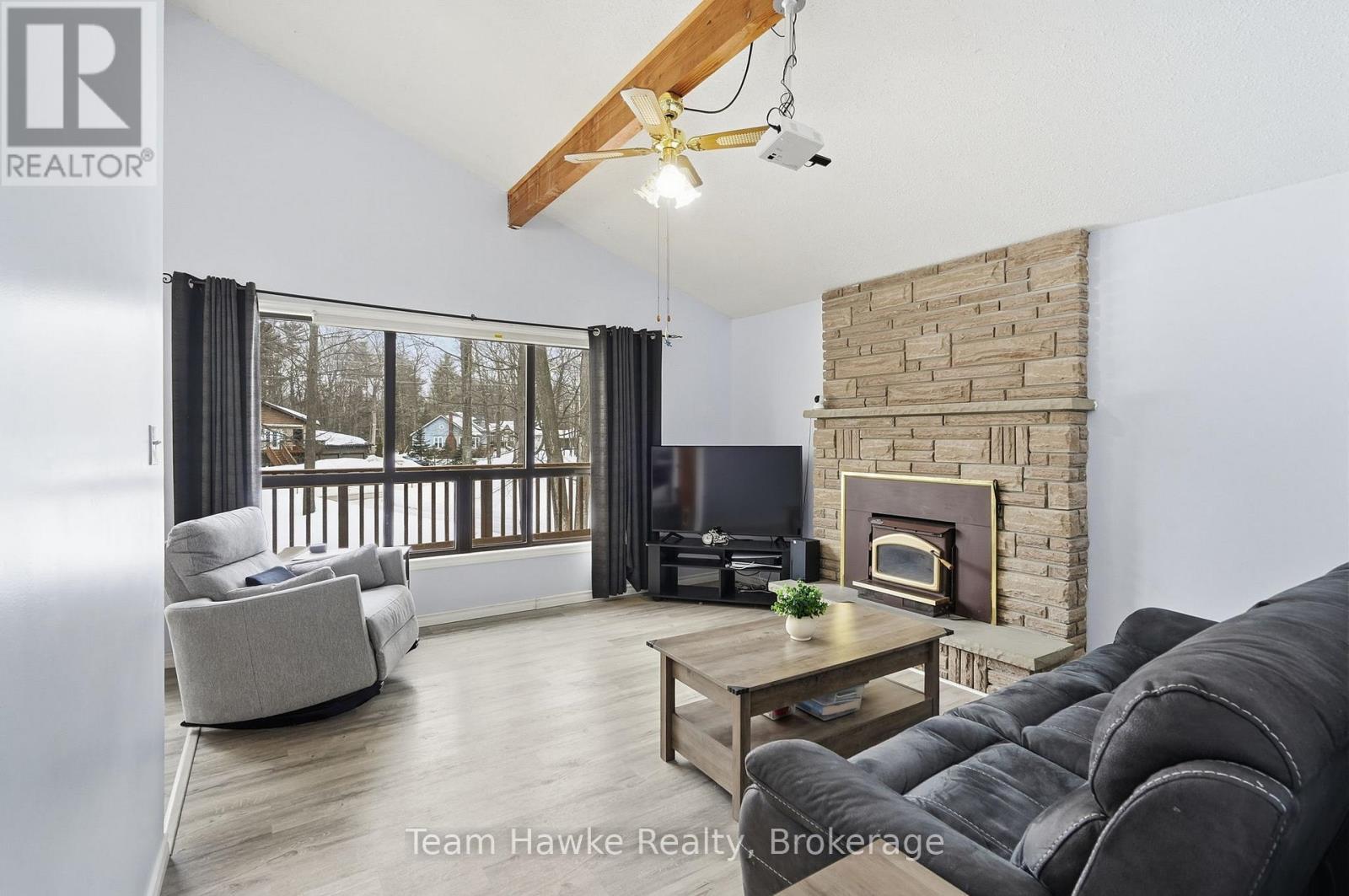 77 Tall Pines Drive, Tiny, ON - Indoor Photo Showing Living Room With Fireplace