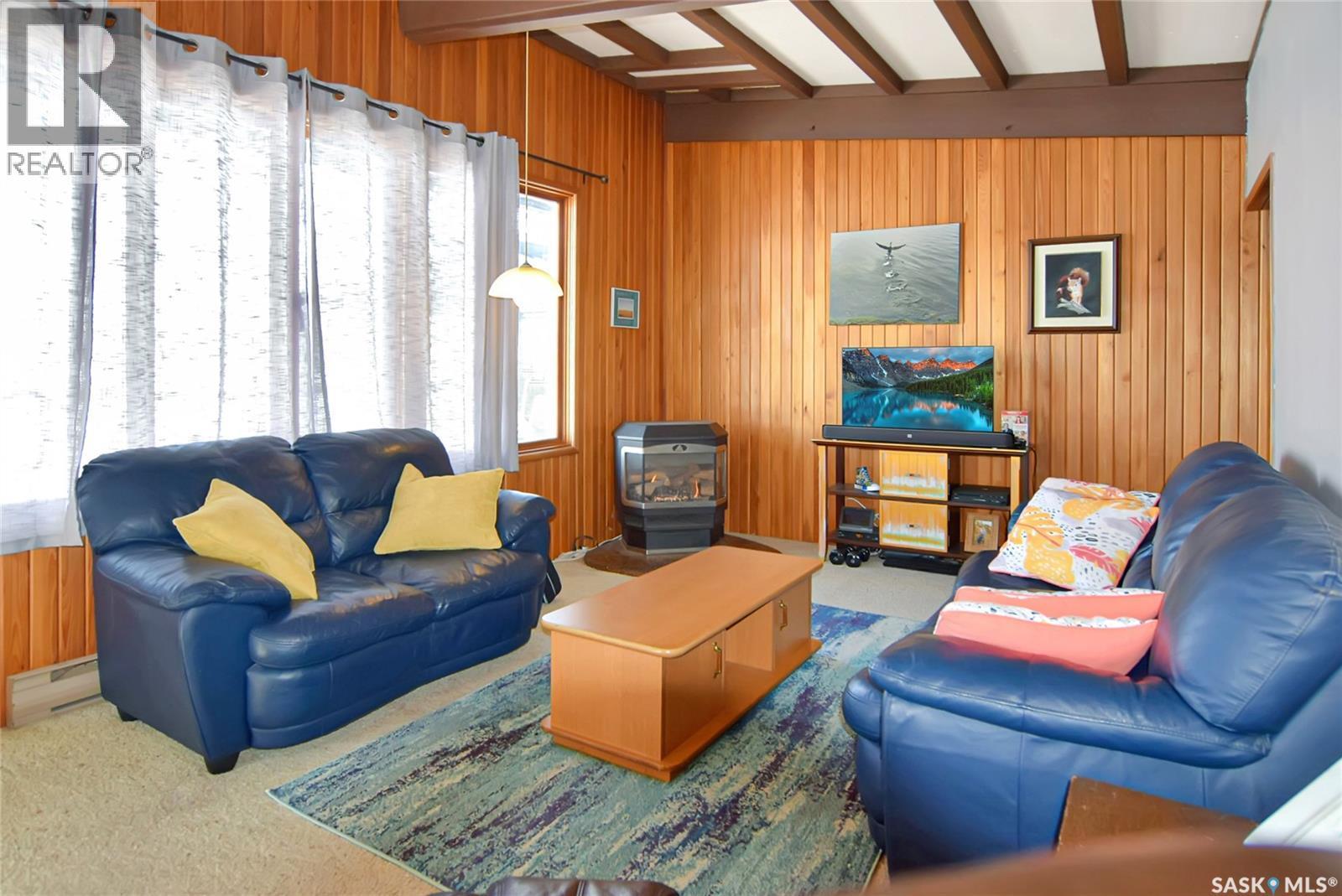 208-210 Criddle Avenue, Crooked Lake, SK - Indoor Photo Showing Living Room With Fireplace