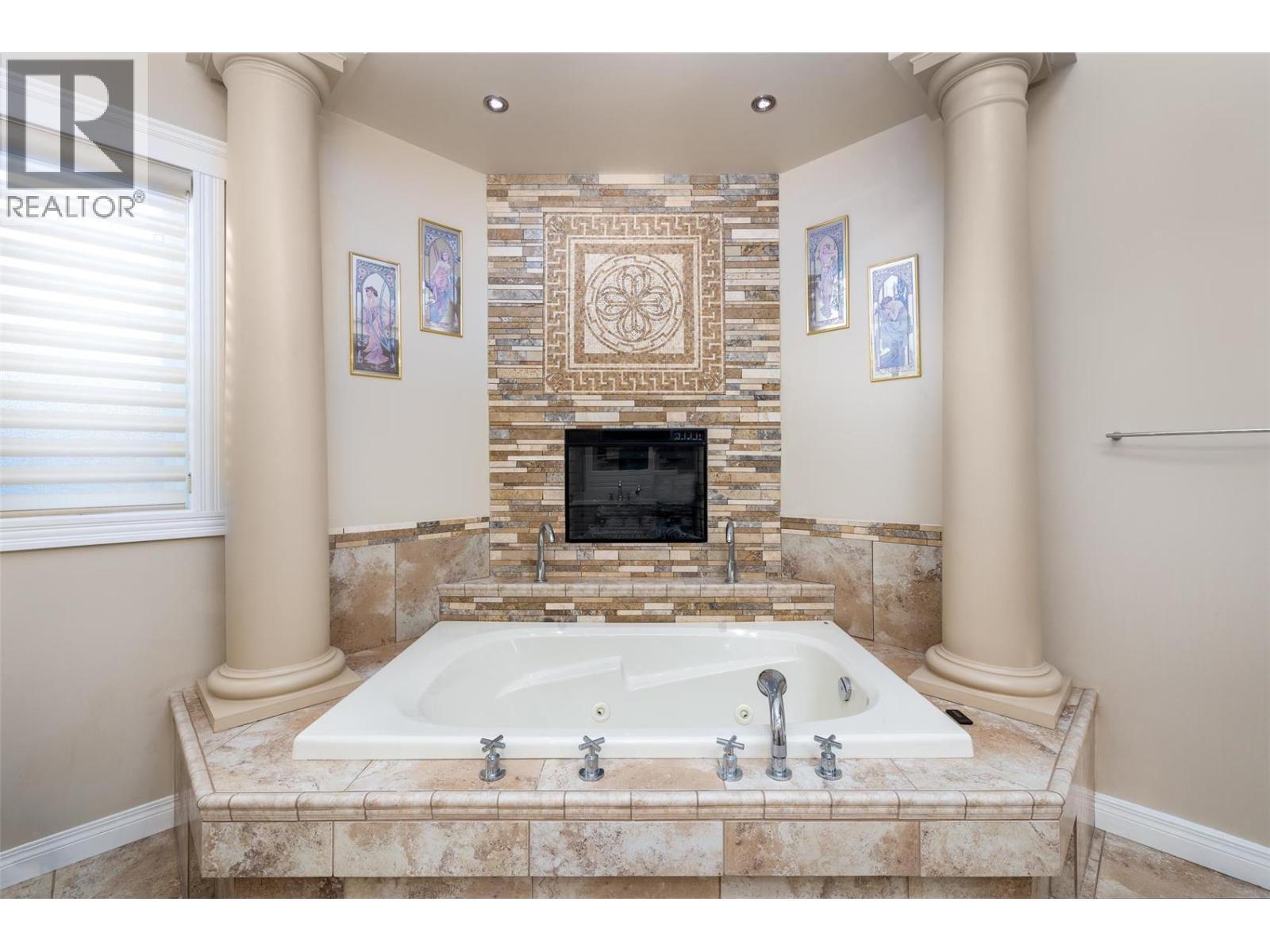 375 Trumpeter Court, Kelowna, BC - Indoor Photo Showing Bathroom With Fireplace