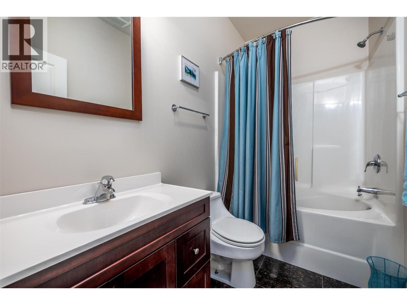 Full bathroom in the basement - 375 Trumpeter Court, Kelowna, BC - Indoor Photo Showing Bathroom