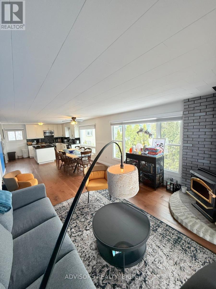 9 Bow Road, Tiny, ON - Indoor Photo Showing Living Room With Fireplace