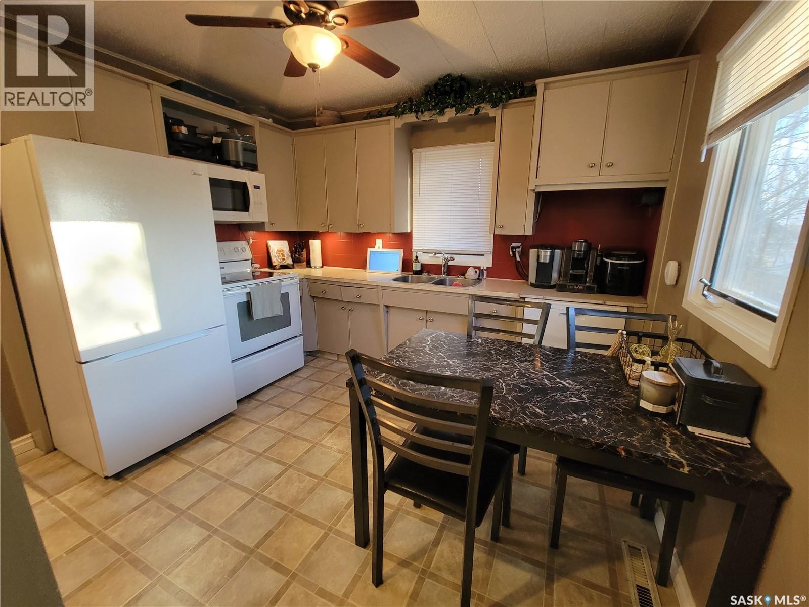 4812 Post Street, Macklin, SK - Indoor Photo Showing Kitchen With Double Sink