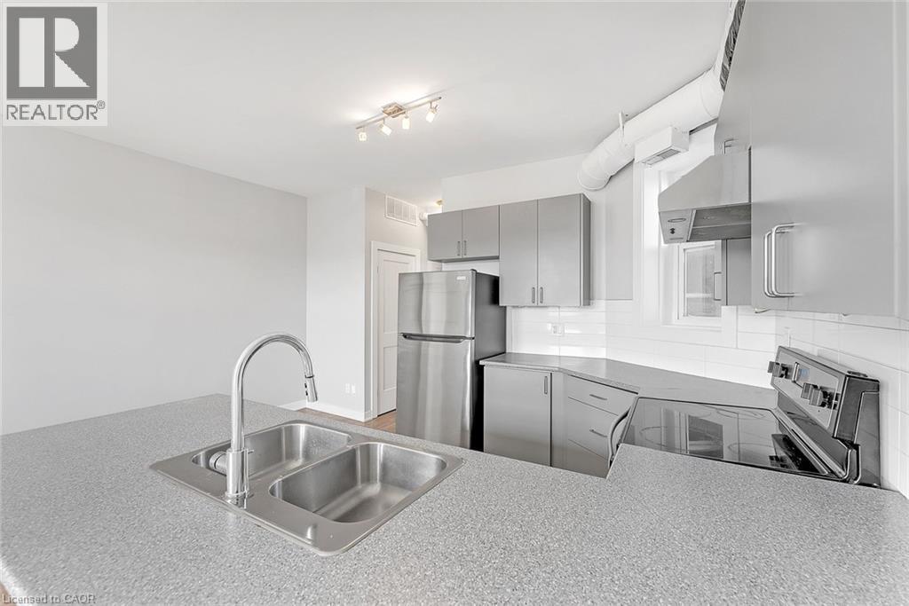 657 Barton Street E Unit# 302, Hamilton, ON - Indoor Photo Showing Kitchen With Double Sink