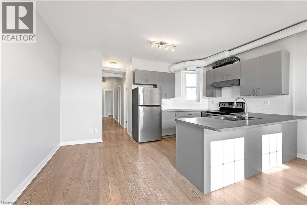 657 Barton Street E Unit# 302, Hamilton, ON - Indoor Photo Showing Kitchen With Stainless Steel Kitchen With Double Sink