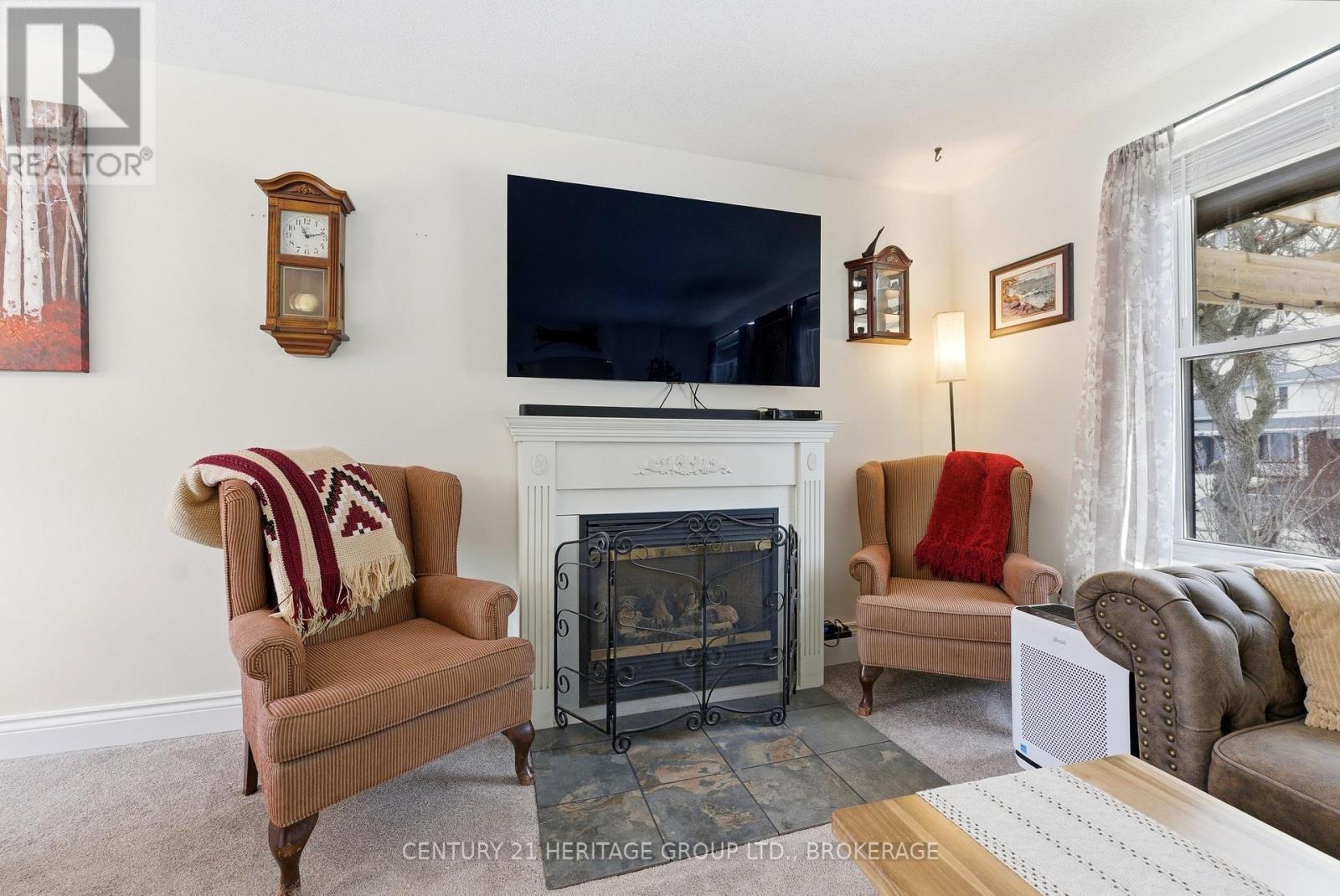 205 Keewatin Street, Oshawa (Donevan), ON - Indoor Photo Showing Living Room With Fireplace