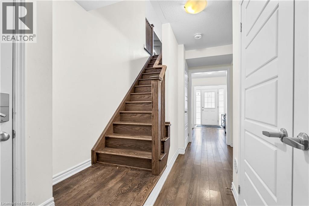Stairway with hardwood / wood-style flooring and baseboards - 143 Ridge Road Unit# 48, Cambridge, ON - Indoor Photo Showing Other Room