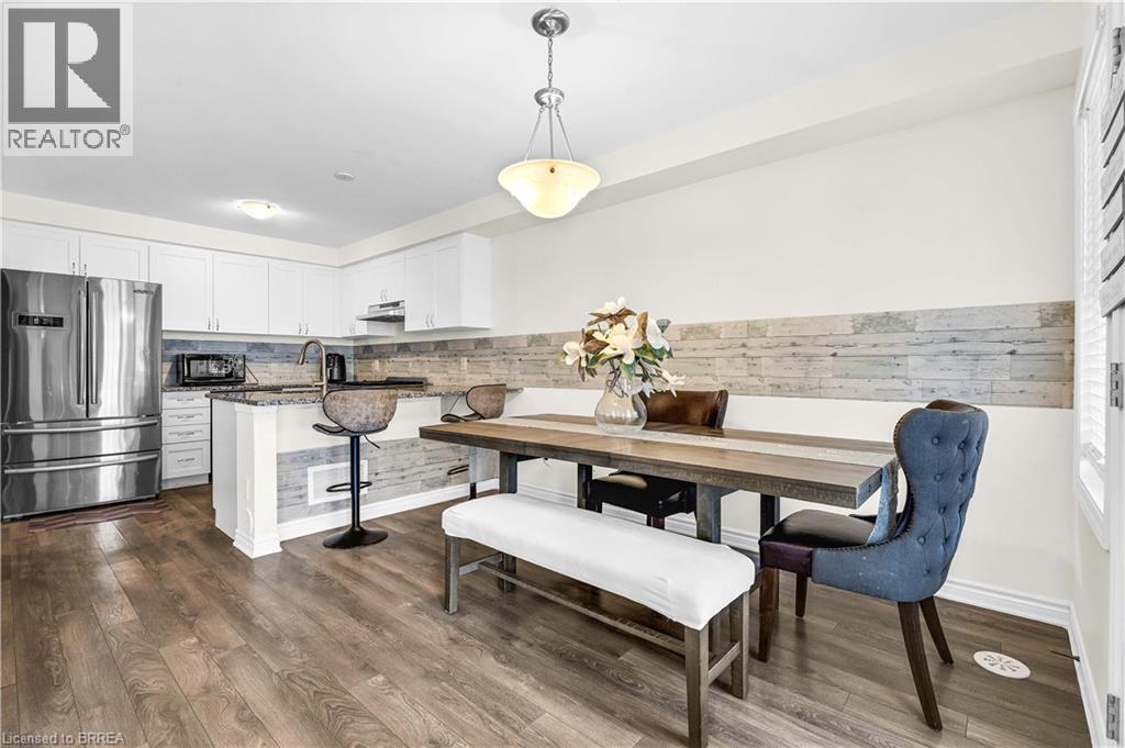 Dining area featuring dark wood-style flooring - 143 Ridge Road Unit# 48, Cambridge, ON - Indoor Photo Showing Other Room