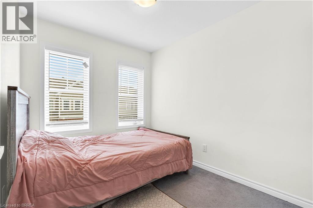 Carpeted bedroom featuring baseboards - 143 Ridge Road Unit# 48, Cambridge, ON - Indoor Photo Showing Bedroom