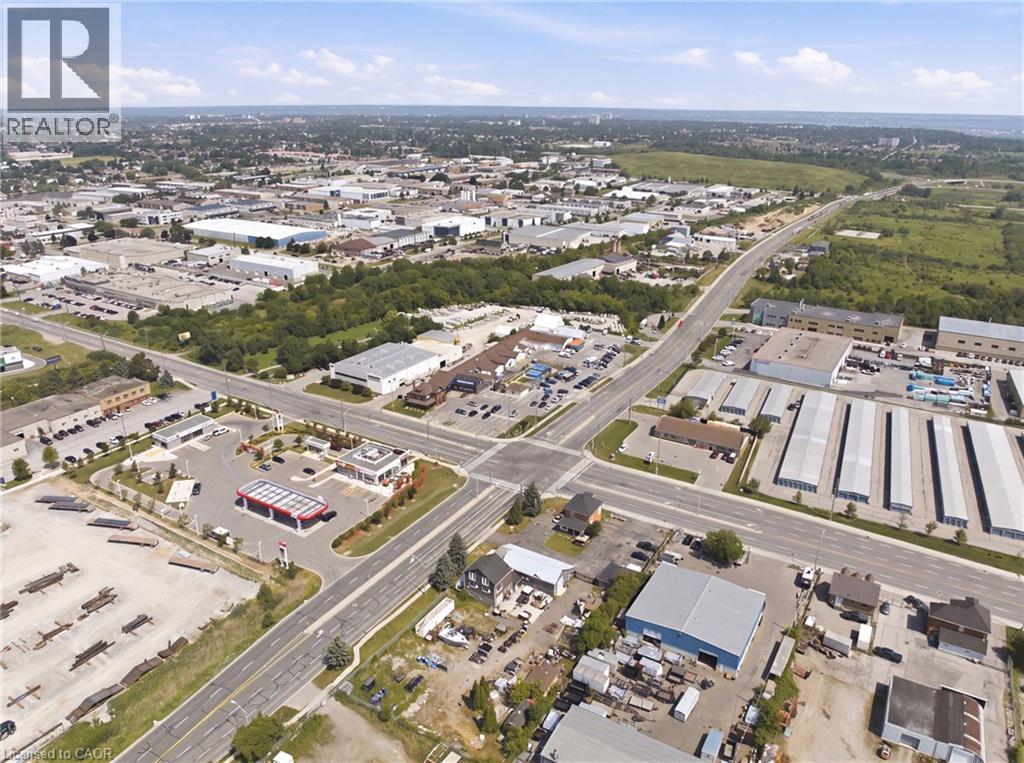 Aerial perspective showcasing an expansive commercial and industrial district - 1360 Rymal Road E, Hamilton, ON