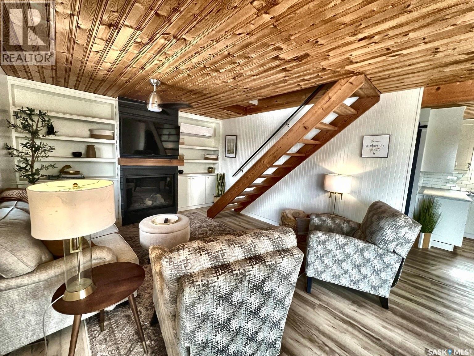 79 Snedden Crescent, Maple Bush Rm No. 224, SK - Indoor Photo Showing Living Room With Fireplace