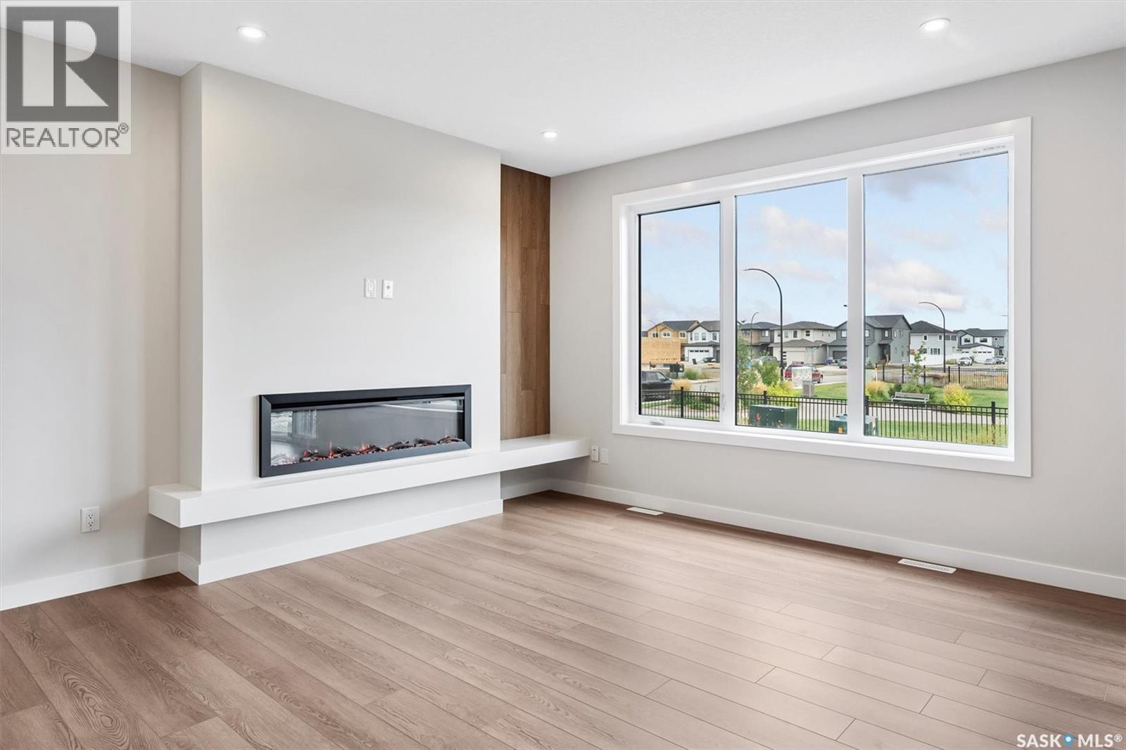 107 Katz Avenue, Saskatoon, SK - Indoor Photo Showing Living Room With Fireplace