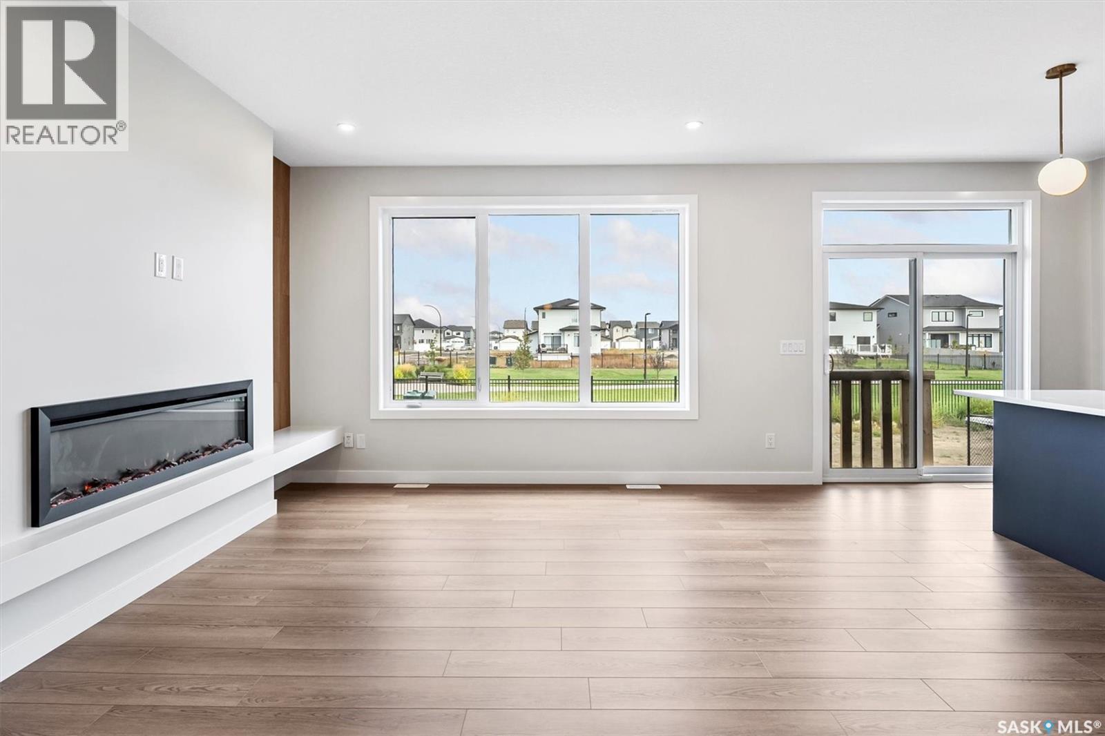107 Katz Avenue, Saskatoon, SK - Indoor Photo Showing Living Room With Fireplace