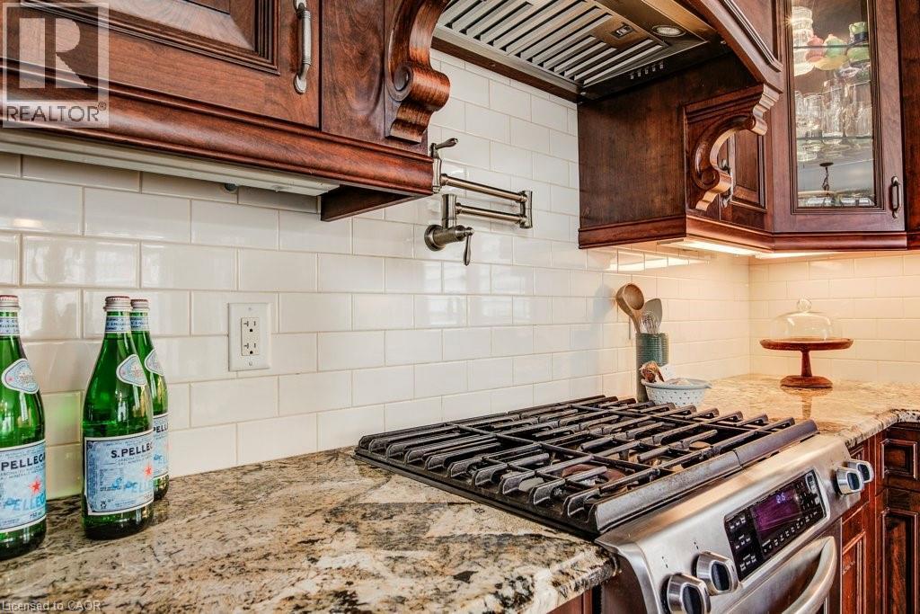 Gas stove with matching hood exhaust - 124 Allen Street E, Waterloo, ON - Indoor Photo Showing Kitchen