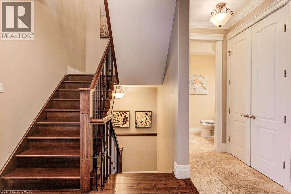Wood staircase to upper and lower levels - 124 Allen Street E, Waterloo, ON - Indoor Photo Showing Other Room