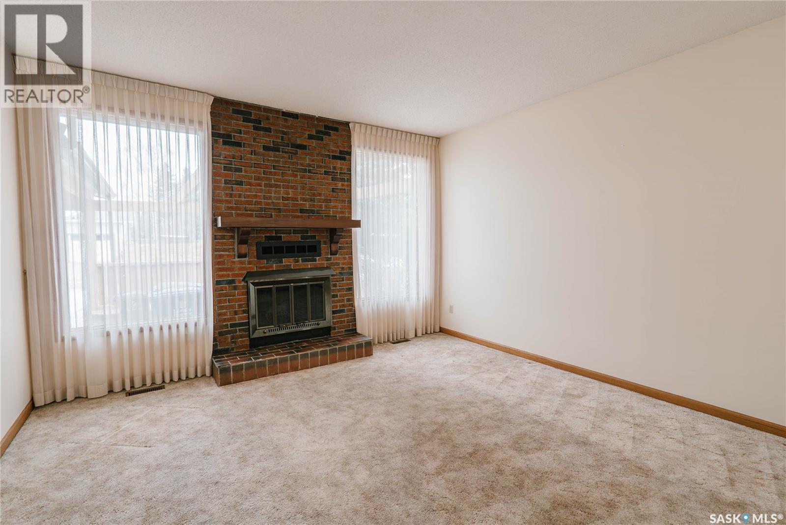 463 Christopher Road, Saskatoon, SK - Indoor Photo Showing Other Room With Fireplace