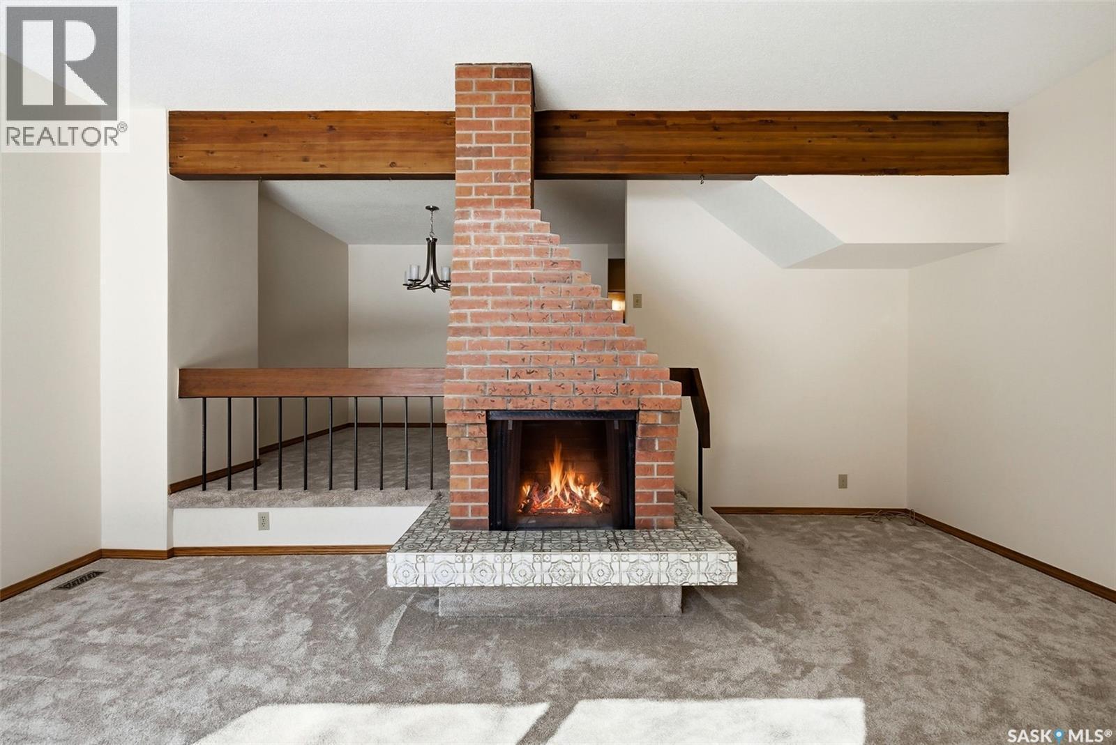 1615 23Rd Avenue, Regina, SK - Indoor Photo Showing Living Room With Fireplace