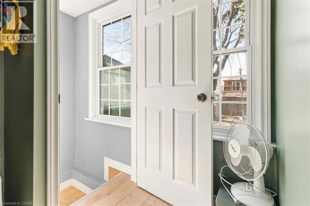 This door can be deadbolted to keep main floor separate from laundry/basement - 29 Wexford Avenue N, Hamilton, ON - Indoor Photo Showing Other Room