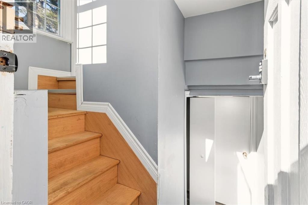Stairs down to shared laundry room and private basement in-law suite - 29 Wexford Avenue N, Hamilton, ON - Indoor Photo Showing Other Room