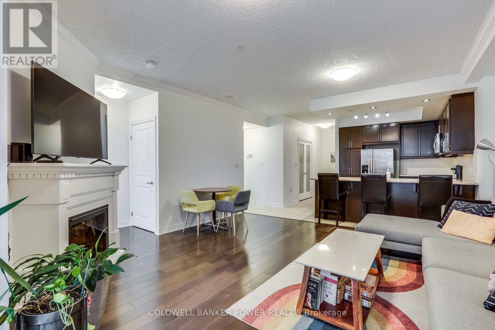 1311 - 330 Ridout Street N, London East (East K), ON - Indoor Photo Showing Living Room With Fireplace