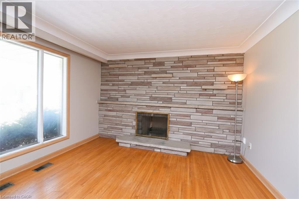142 Delmar Drive, Hamilton, ON - Indoor Photo Showing Other Room With Fireplace