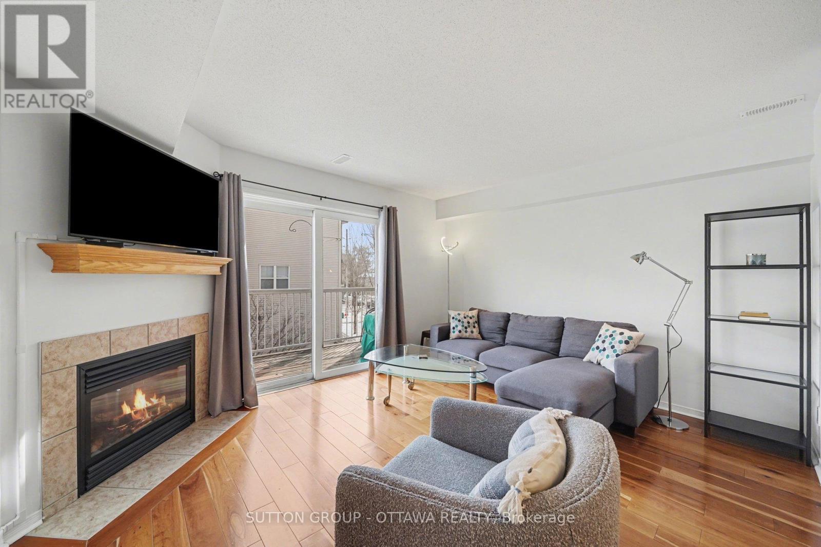56 Steele Park Private, Ottawa, ON - Indoor Photo Showing Living Room With Fireplace