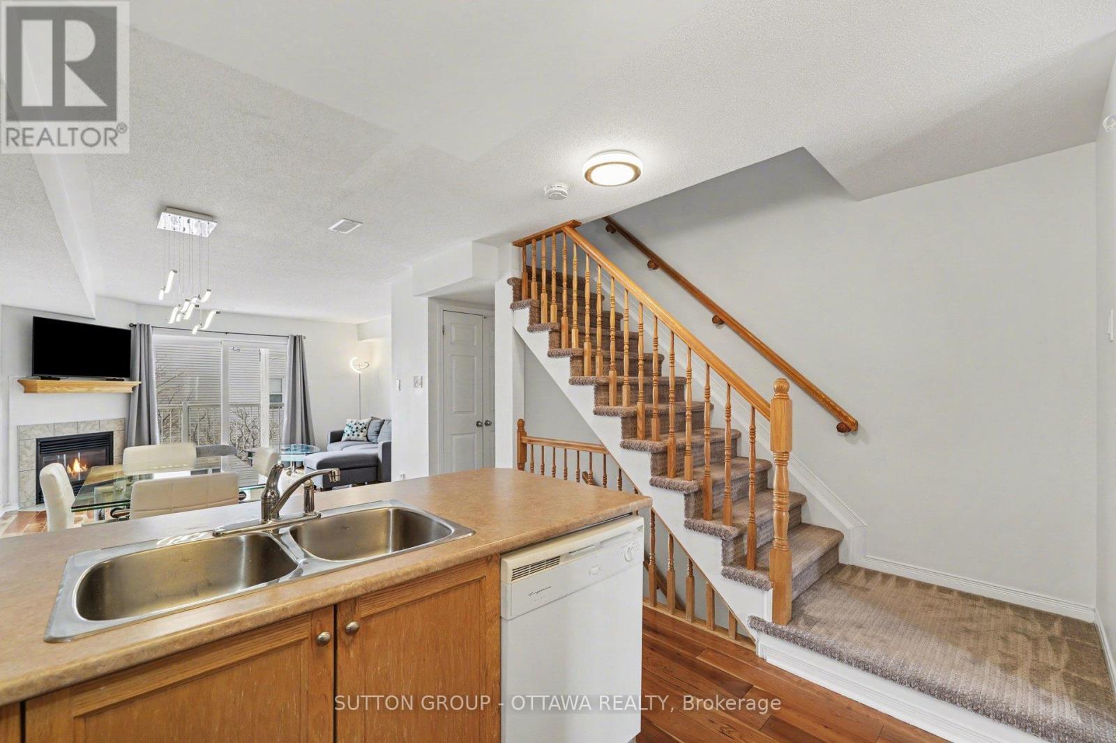 56 Steele Park Private, Ottawa, ON - Indoor Photo Showing Kitchen With Fireplace With Double Sink