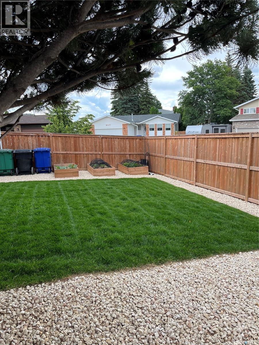 154 Candle Crescent, Saskatoon, SK - Outdoor With Backyard