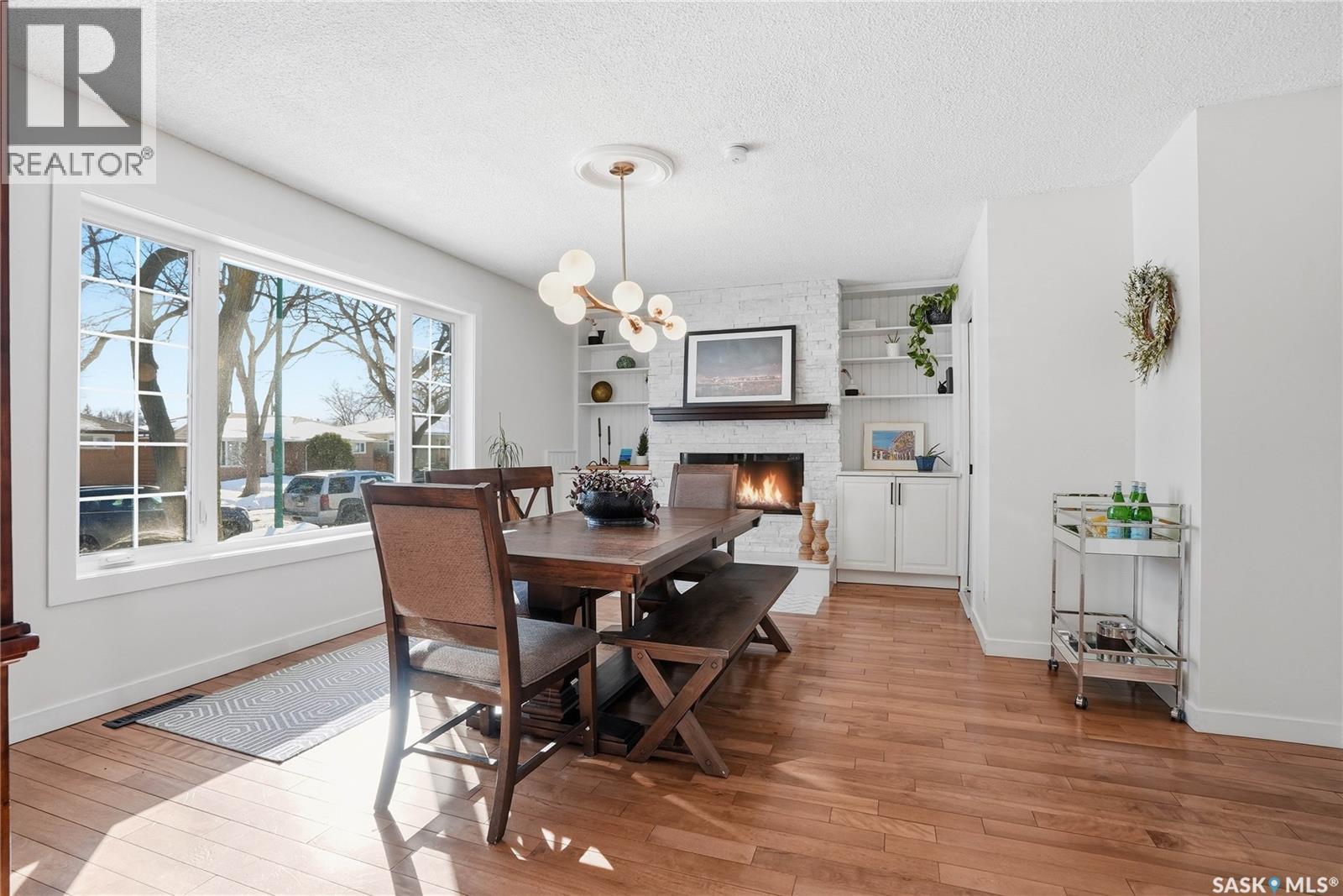 1033 9Th Street E, Saskatoon, SK - Indoor Photo Showing Dining Room With Fireplace