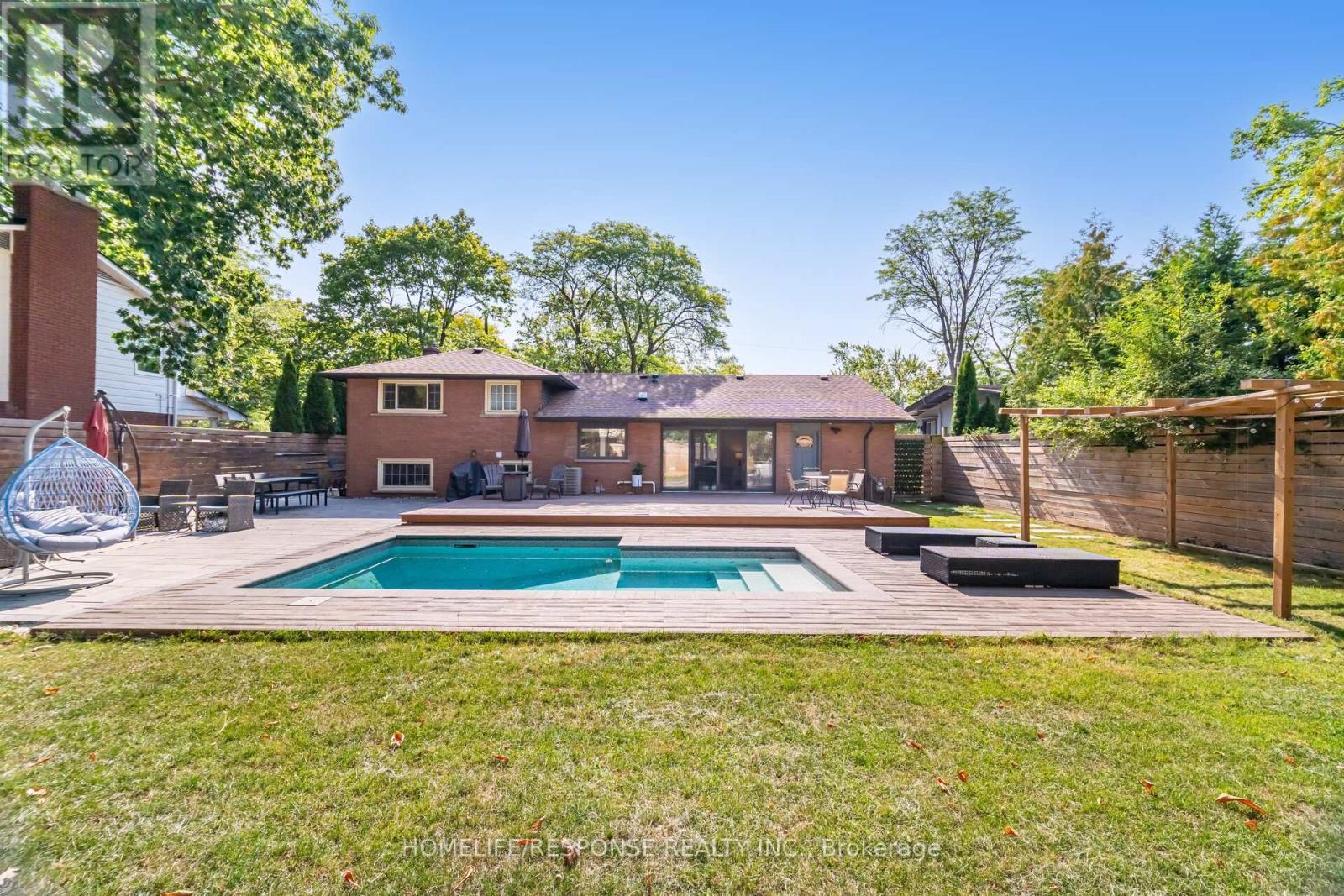 5011 Spruce Avenue, Burlington, ON - Outdoor With In Ground Pool With Deck Patio Veranda With Backyard