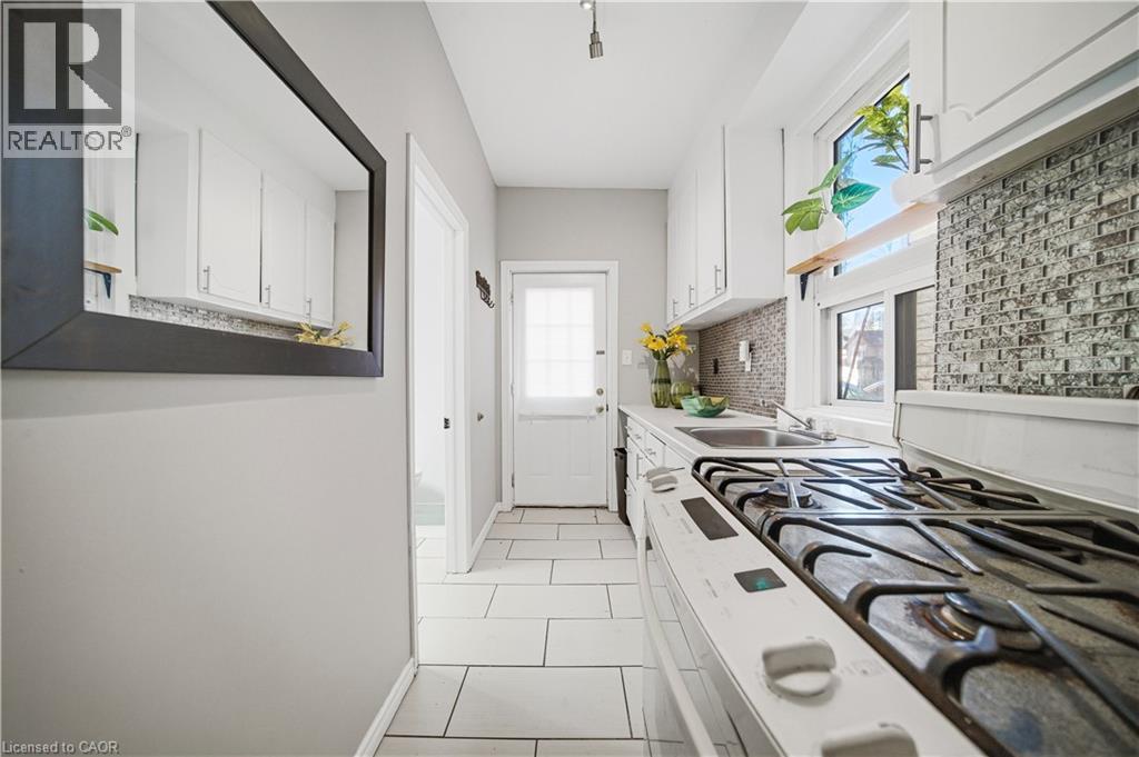 Kitchen (Main Floor). Gas Stove. - 107 Queen Street S, Hamilton, ON - Indoor