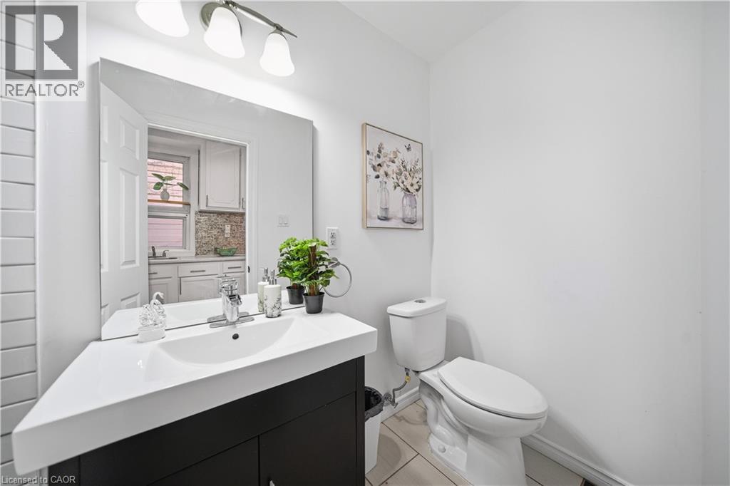 Bathroom. (Main Floor) 3 Piece Bath - Glass Shower with Subway Tile Surround - 107 Queen Street S, Hamilton, ON - Indoor Photo Showing Bathroom