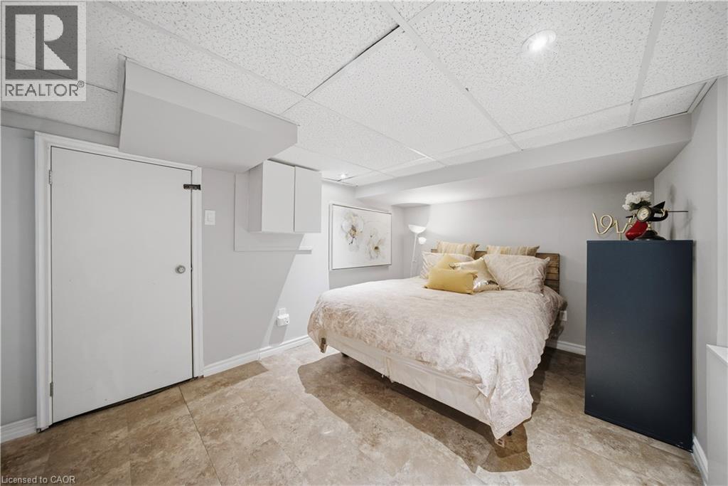 Basement Room, Currently Set Up as Bedroom,/Office, Laundry Located Just Behind - 107 Queen Street S, Hamilton, ON - Indoor Photo Showing Bedroom