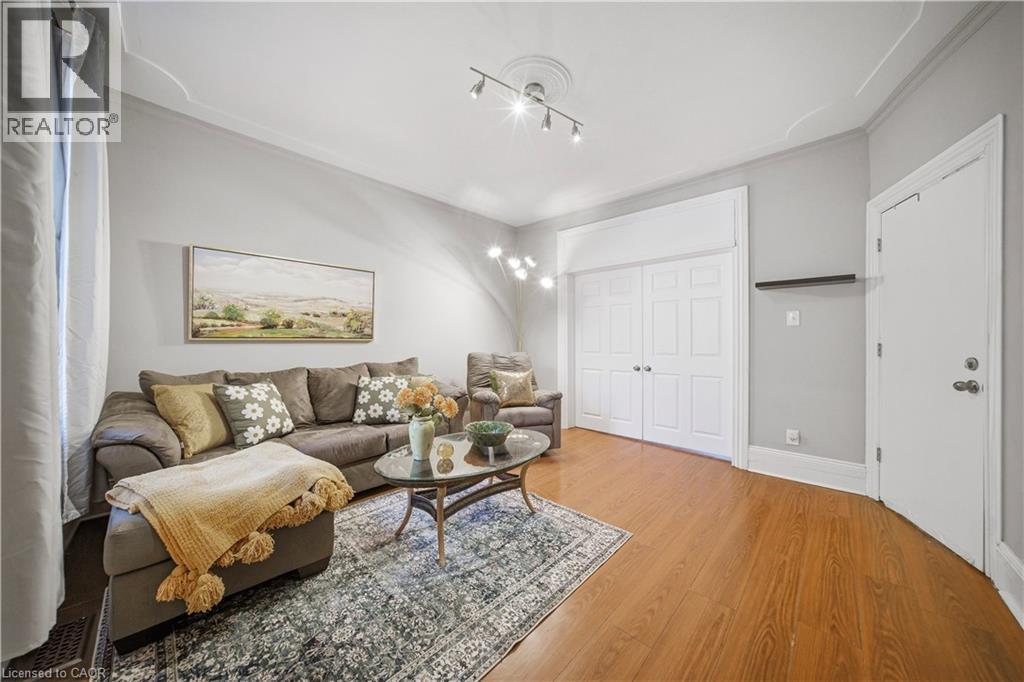 Main floor Living Room. High Ceilings, Decorative Crown Molding - 107 Queen Street S, Hamilton, ON - Indoor Photo Showing Living Room
