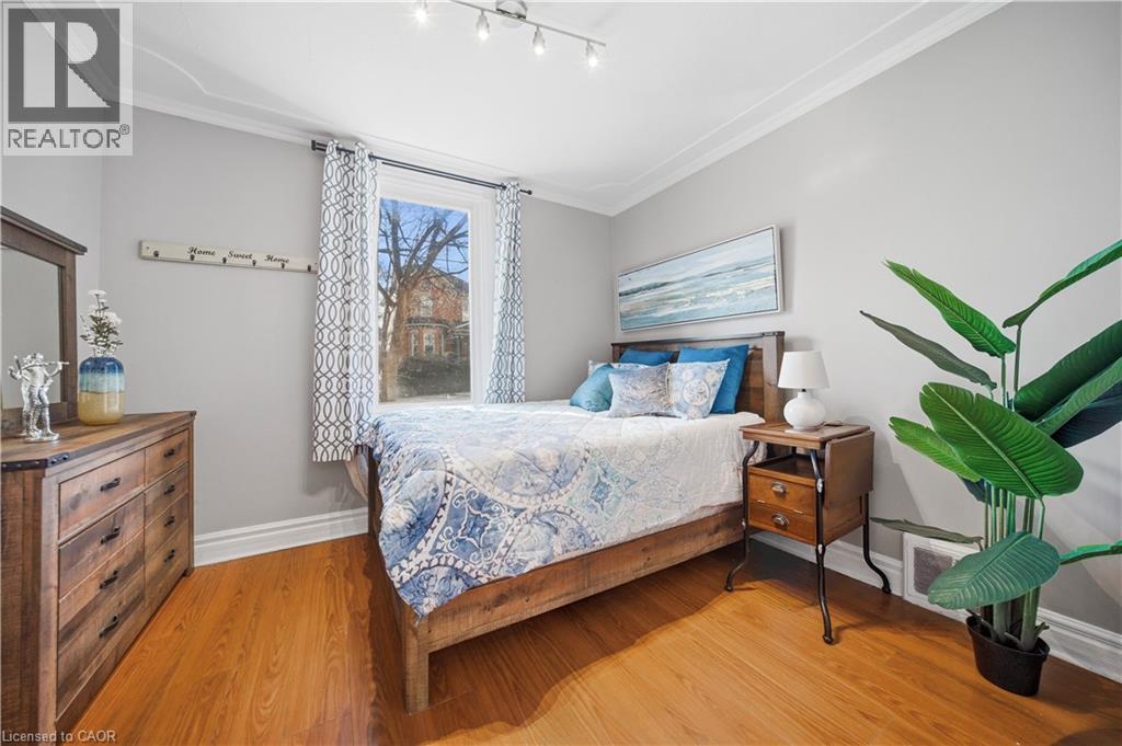 Main Floor Bedroom. Main Floor, High Ceilings with Decorative Molding, Double Entry Doors - 107 Queen Street S, Hamilton, ON - Indoor Photo Showing Bedroom