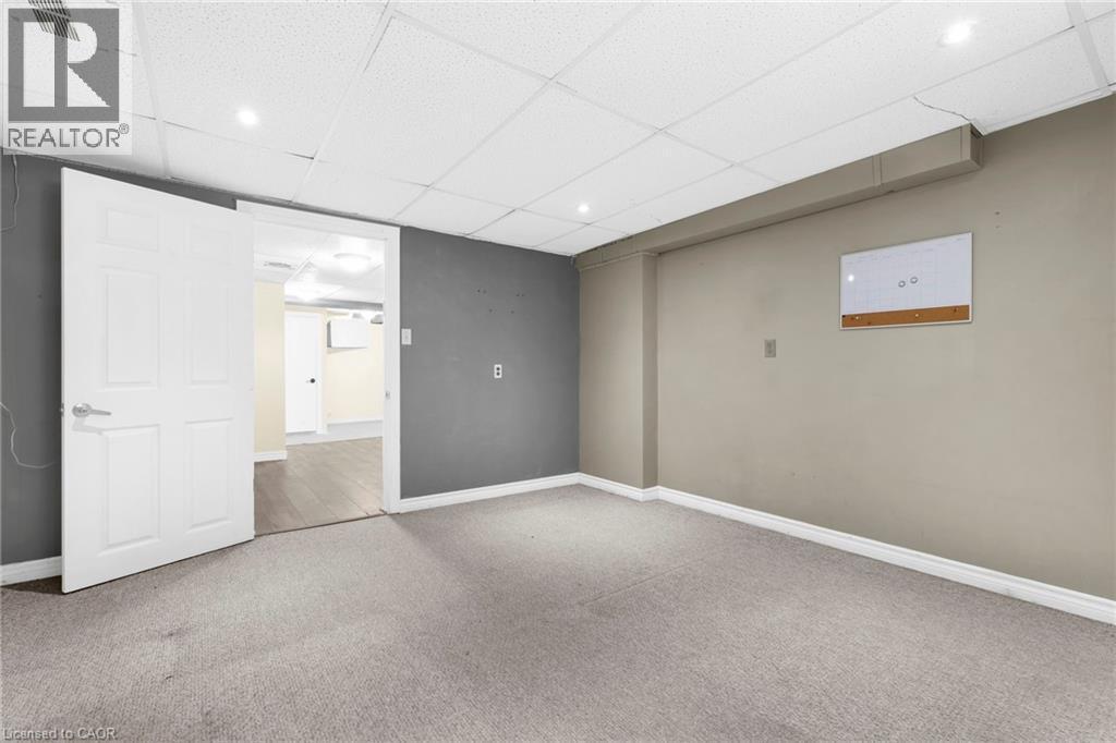 Finished below grade area featuring a drop ceiling, carpet floors, and recessed lighting - 368 Upper Kenilworth Avenue, Hamilton, ON - Indoor