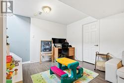 DOOR TO LARGE STORAGE AREA & HVAC/LAUNDRY ROOM -