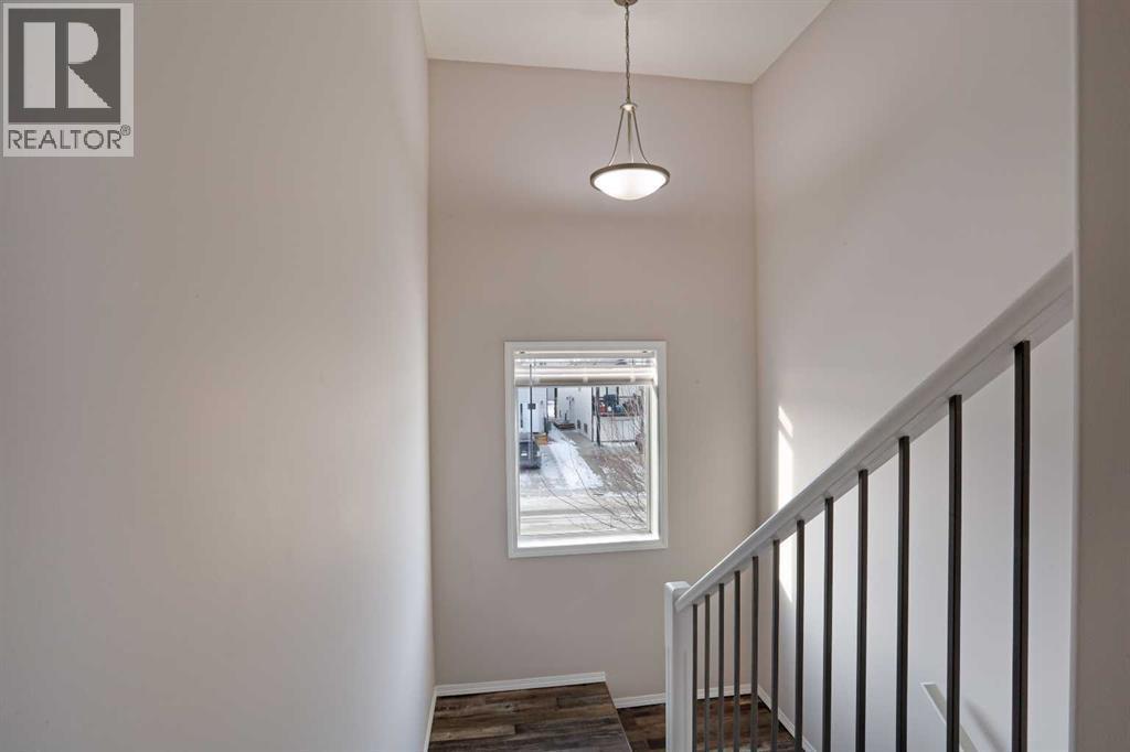 Top Landing looking westerly - 322 17 Street E, Brooks, AB - Indoor Photo Showing Other Room