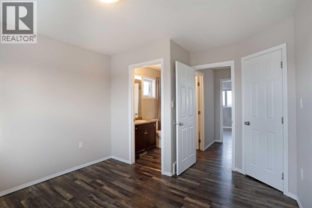 Top Floor - Primary Bedroom - 322 17 Street E, Brooks, AB - Indoor Photo Showing Other Room