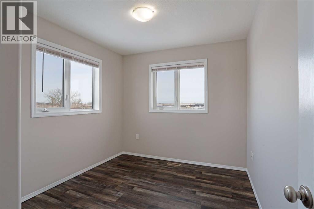 Top Floor - 2nd Bedroom w/two windows (1 northerly & 1 easterly) - 322 17 Street E, Brooks, AB - Indoor Photo Showing Other Room