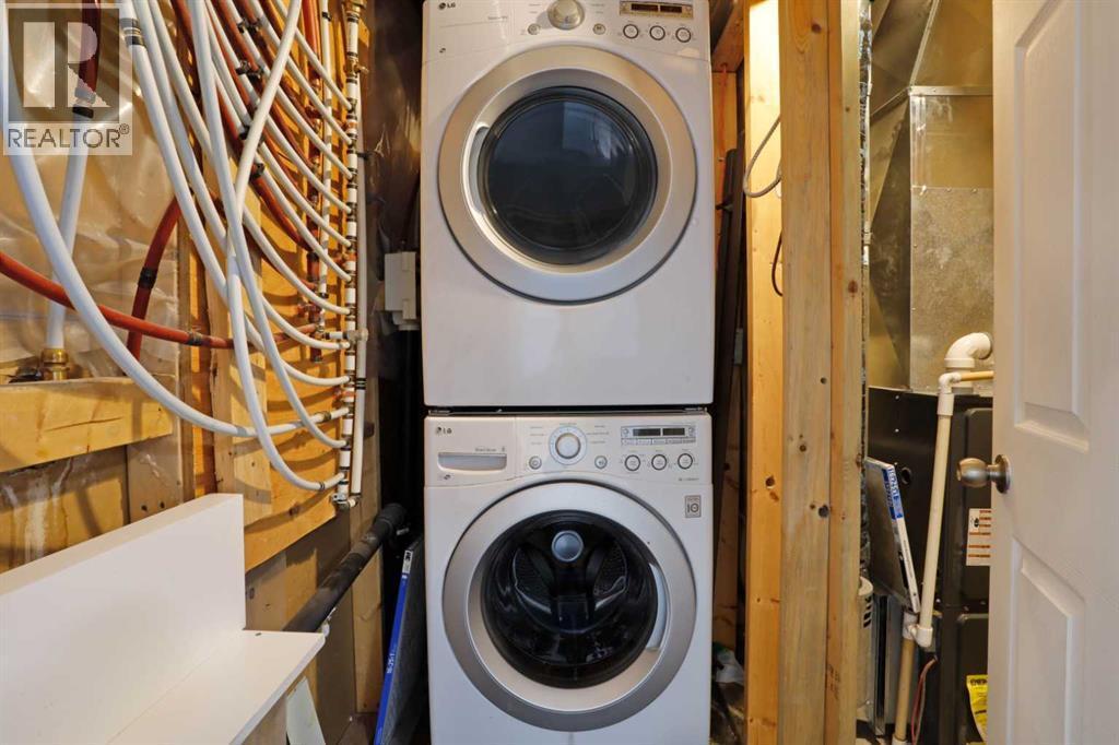 Basement Laundry & Furnace Room - 322 17 Street E, Brooks, AB - Indoor Photo Showing Laundry Room