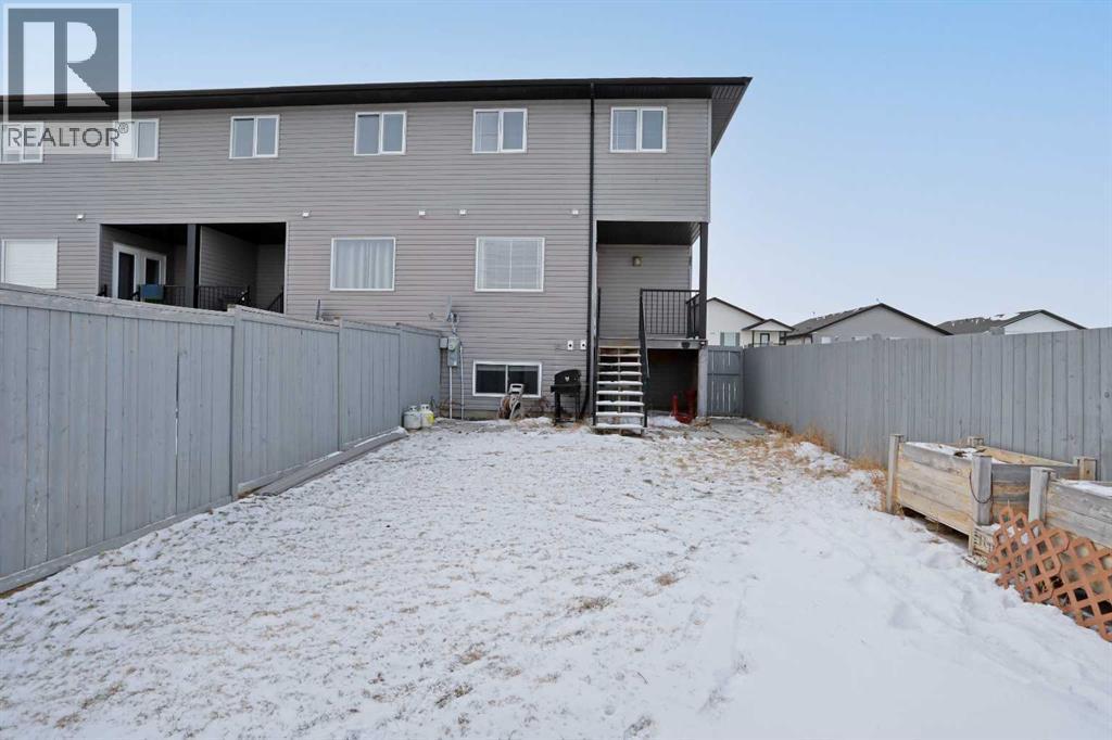 Back off home looking from back yard - 322 17 Street E, Brooks, AB - Outdoor With Exterior
