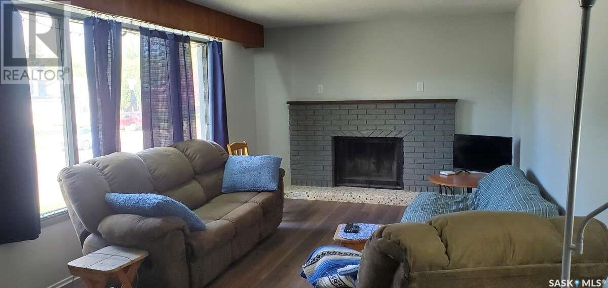 1491 112Th Street, North Battleford, SK - Indoor Photo Showing Living Room With Fireplace