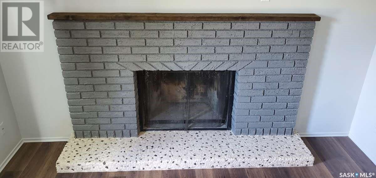 1491 112Th Street, North Battleford, SK - Indoor Photo Showing Living Room With Fireplace