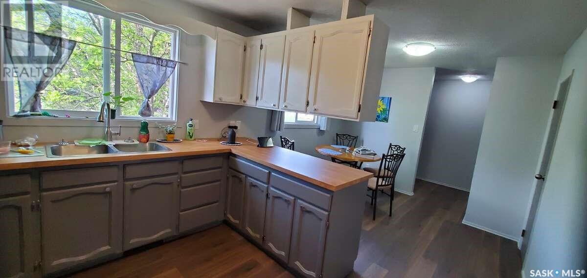 1491 112Th Street, North Battleford, SK - Indoor Photo Showing Kitchen With Double Sink