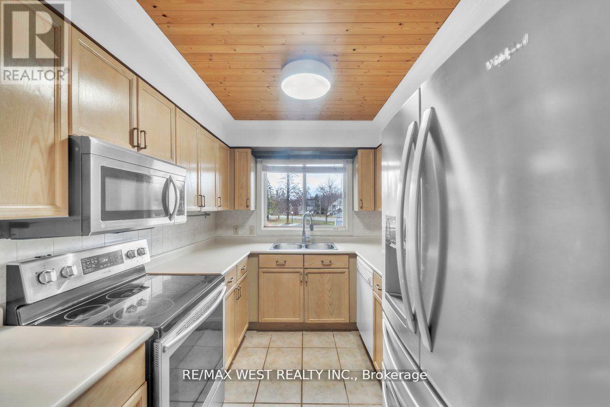 9 - 24 Laguna Parkway, Ramara, ON - Indoor Photo Showing Kitchen With Stainless Steel Kitchen With Double Sink