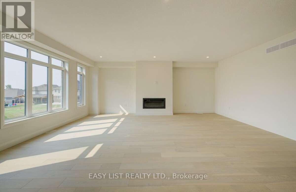 57 Bricker Avenue, Centre Wellington, ON - Indoor Photo Showing Other Room With Fireplace