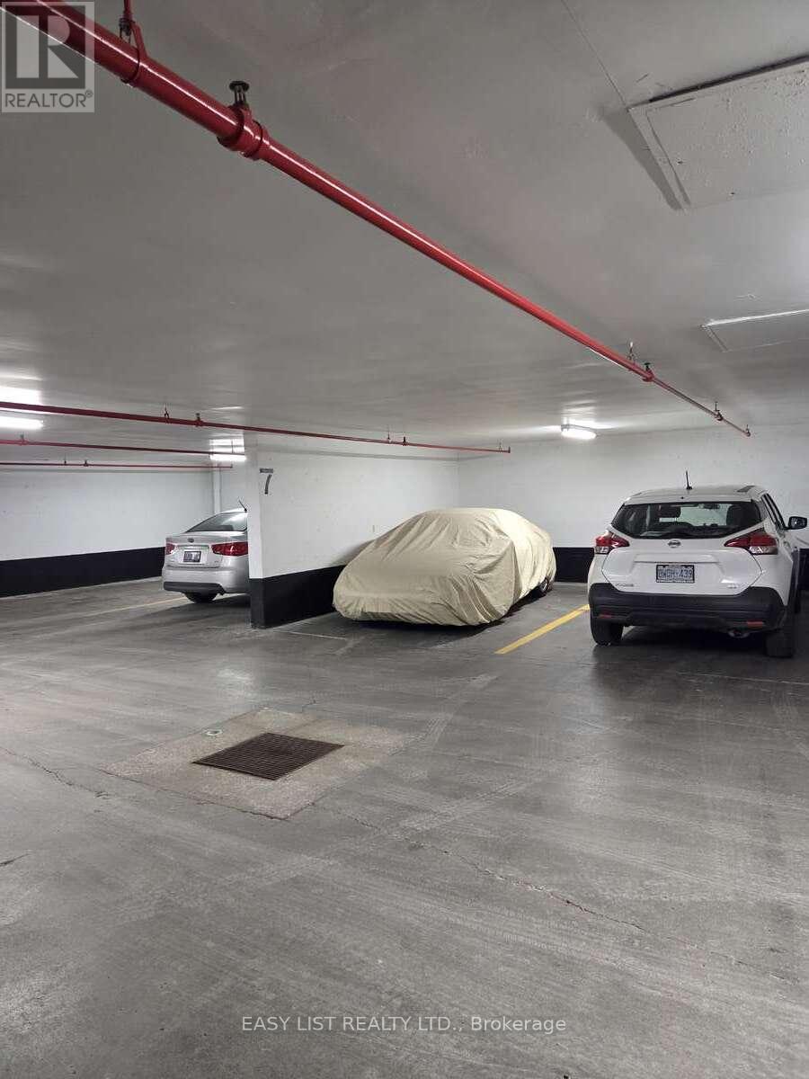 203 - 155 Main Street N, Newmarket, ON - Indoor Photo Showing Garage