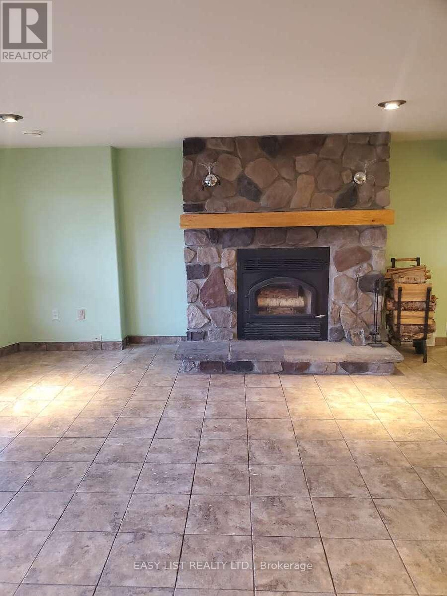 477 Hwy 586, Thunder Bay, ON - Indoor Photo Showing Living Room With Fireplace