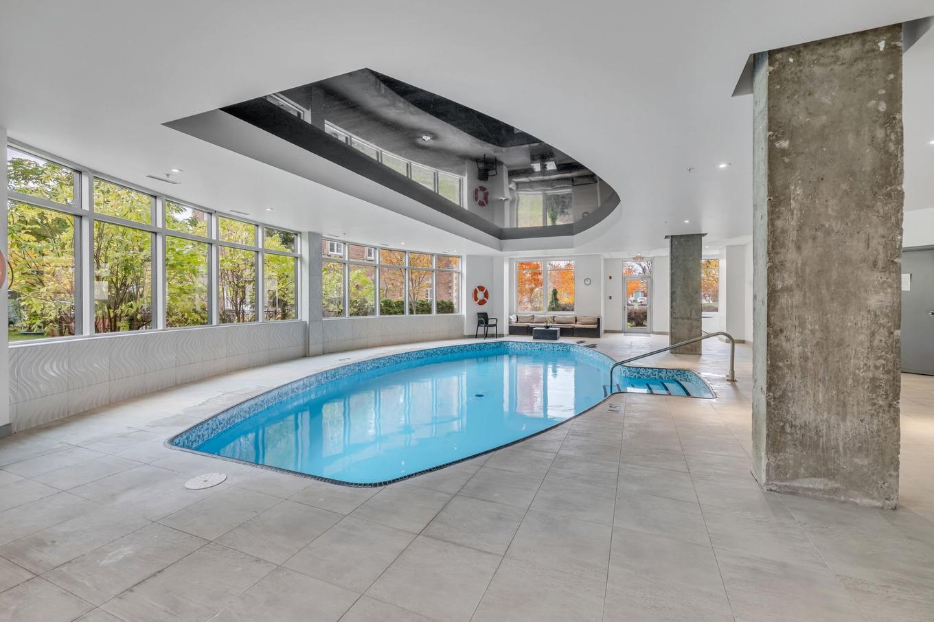 Pool - 205-5692 Rue St-Louis, Lévis (Desjardins), QC - Indoor Photo Showing Other Room With In Ground Pool