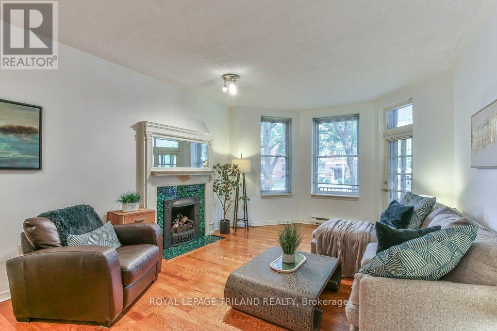 101 - 285 Queens Avenue, London East (East F), ON - Indoor Photo Showing Living Room With Fireplace